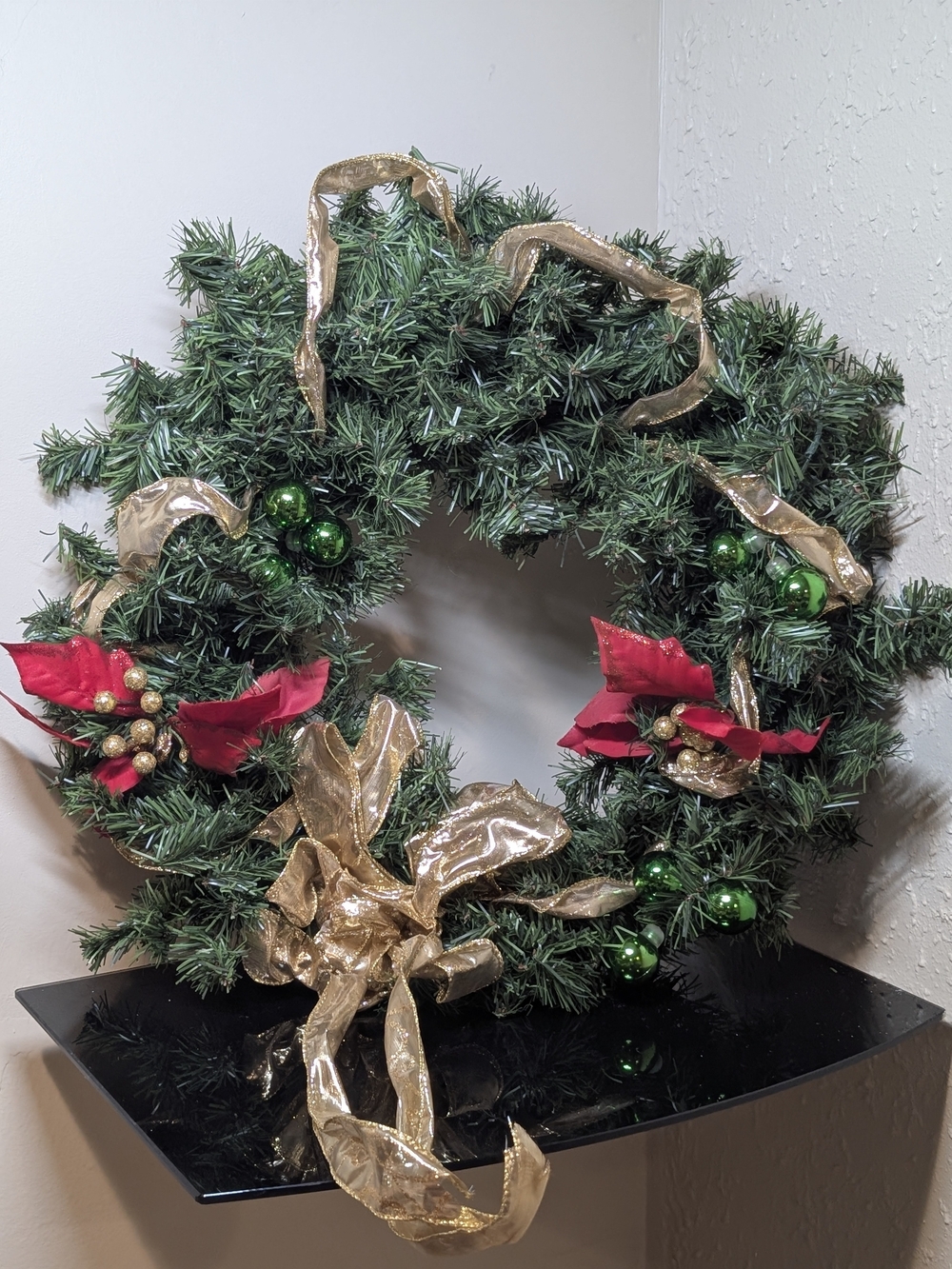 Classic Green Holiday Wreath with Gold Ribbon and Red Poinsettias
